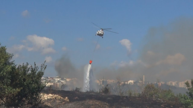 Avcılar’da otluk alanda çıkan yangın helikopter yardımıyla söndürüldü